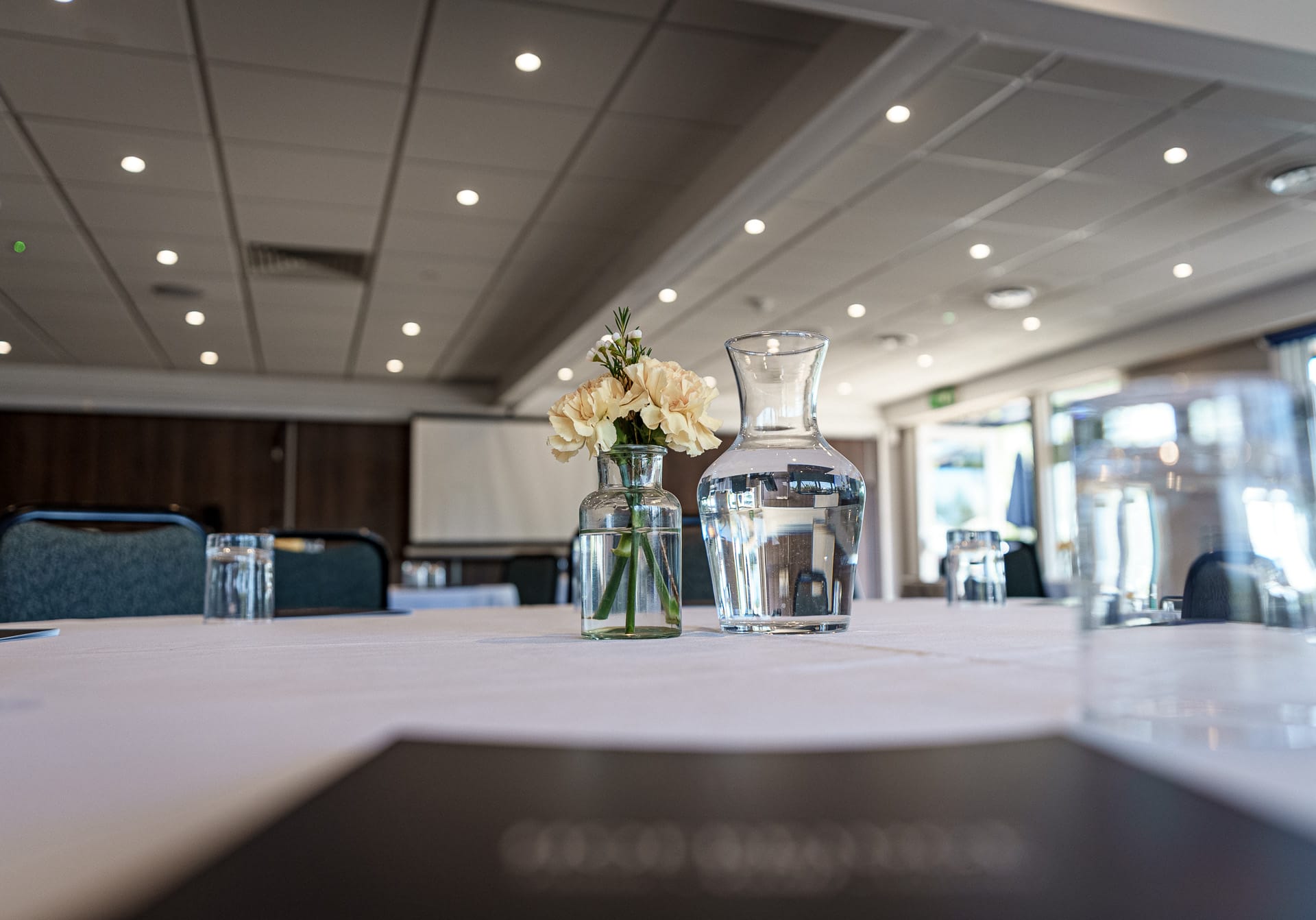 flower vase and water jug at a meeting room for hire in woking