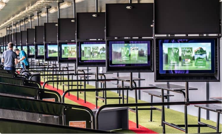 several driving range bays with ball tracking technology and games at the leading driving range in surrey