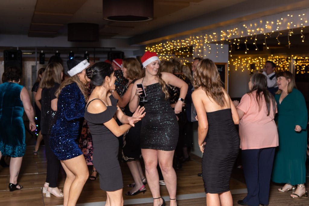 women dancing on a festive dance floor at a christmas party near woking