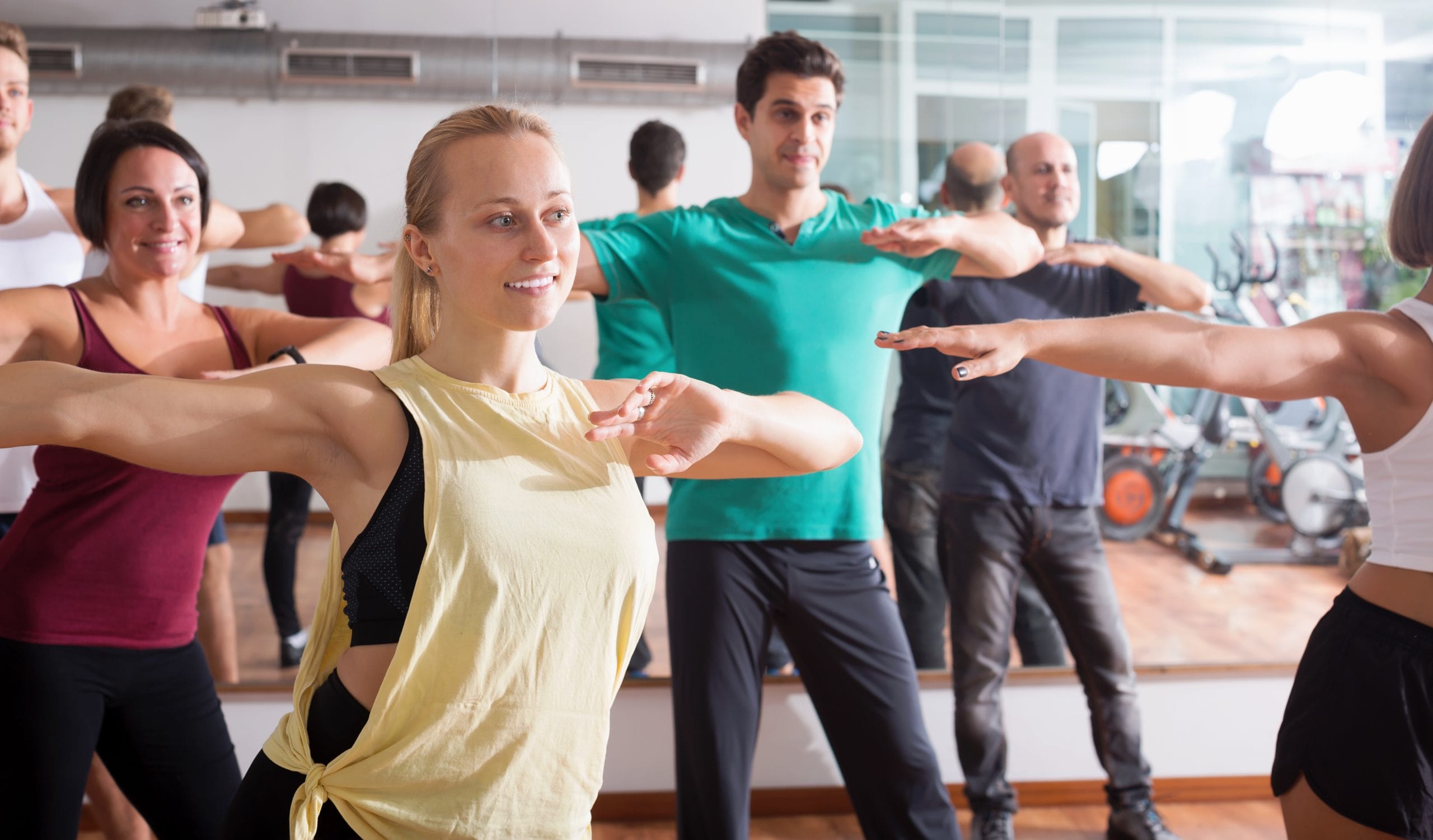 group fitness with participants smiling at a group fitness in woking